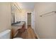 A light and airy bathroom, with tile floor, and new light fixtures at 20781 E 48Th Pl, Denver, CO 80249