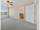 Bright bedroom with a carpeted floor and view into the en-suite bathroom at 20781 E 48Th Pl, Denver, CO 80249