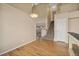 Hardwood dining area featuring modern lighting, stair access, and ample natural light at 20781 E 48Th Pl, Denver, CO 80249