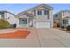 Charming two-story home featuring a covered front porch and a two-car garage in a desirable neighborhood at 20781 E 48Th Pl, Denver, CO 80249