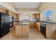 Spacious kitchen with wooden cabinets, kitchen island, and stainless steel appliances at 20781 E 48Th Pl, Denver, CO 80249