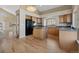 Kitchen with a center island, wood floors and modern appliances at 20781 E 48Th Pl, Denver, CO 80249