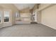 Bright living room featuring vaulted ceilings, neutral carpet, and expansive windows for natural light at 20781 E 48Th Pl, Denver, CO 80249