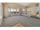 Open living room featuring high ceilings, large windows, and modern lighting fixtures at 20781 E 48Th Pl, Denver, CO 80249