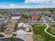 Overhead view of a residential neighborhood with green spaces and a mix of single-Gathering homes at 21682 E Stroll Ave, Parker, CO 80138