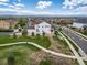 Aerial view of a white two-story home with a well-manicured front lawn and a walkway at 21682 E Stroll Ave, Parker, CO 80138