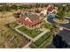 A picturesque aerial view of a community recreation center with rustic buildings and outdoor seating at 21682 E Stroll Ave, Parker, CO 80138