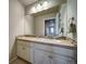 Well-lit bathroom vanity with decorative backsplash and ample counter space at 21682 E Stroll Ave, Parker, CO 80138
