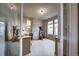Bright bedroom featuring a desk, exercise machine and several windows with bright natural light at 21682 E Stroll Ave, Parker, CO 80138
