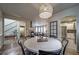 Open concept dining room with views of the stairway, living room, and kitchen at 21682 E Stroll Ave, Parker, CO 80138