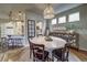 Dining room view showcasing an open floor plan to the kitchen and dining area at 21682 E Stroll Ave, Parker, CO 80138