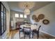 Charming dining room with a round table, decorative chandelier and wall decor at 21682 E Stroll Ave, Parker, CO 80138