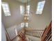 Bright entryway with staircase, high ceilings, and natural light from multiple windows at 21682 E Stroll Ave, Parker, CO 80138