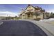 A building with an industrial and rustic design, with beige siding, brown accents, and a silo attached at 21682 E Stroll Ave, Parker, CO 80138