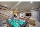 Game room featuring foosball table, basketball game, tv and home office at 21682 E Stroll Ave, Parker, CO 80138