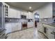Bright, modern kitchen featuring stainless steel appliances and stylish tile backsplash at 21682 E Stroll Ave, Parker, CO 80138