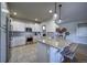 Modern kitchen with stainless steel appliances, granite counters and stylish cabinets at 21682 E Stroll Ave, Parker, CO 80138