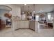 Open concept kitchen flows into the dining and living areas, creating a seamless living space at 21682 E Stroll Ave, Parker, CO 80138