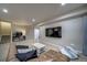 Living room offering seating, a television and access to the home office at 21682 E Stroll Ave, Parker, CO 80138