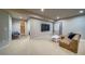 Spacious living room featuring recessed lighting, a tv, and plush seating at 21682 E Stroll Ave, Parker, CO 80138