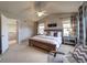 Spacious main bedroom featuring vaulted ceiling, ceiling fan, and ensuite bath access at 21682 E Stroll Ave, Parker, CO 80138