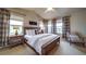 Spacious main bedroom features large windows, ample natural light and a comfortable king size bed at 21682 E Stroll Ave, Parker, CO 80138