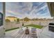 Outdoor patio featuring a striped rug, chairs, a small grassy area, and a white lattice fence at 21682 E Stroll Ave, Parker, CO 80138