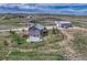 Aerial view of the stunning property, showcasing its serene rural setting and fenced backyard at 6957 Black Forest Dr, Elizabeth, CO 80107