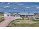 Aerial of the house, with an attached garage and detached barn at 6957 Black Forest Dr, Elizabeth, CO 80107