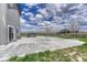 Backyard featuring a spacious concrete patio and view of the open land at 6957 Black Forest Dr, Elizabeth, CO 80107