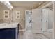 Modern bathroom featuring a stylish vanity, tile flooring, and contemporary design at 6957 Black Forest Dr, Elizabeth, CO 80107
