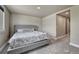 Comfortable bedroom with a large bed, carpet and stylish decor at 6957 Black Forest Dr, Elizabeth, CO 80107