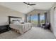 Spacious bedroom with vaulted ceilings, plush carpeting, and abundant natural light at 6957 Black Forest Dr, Elizabeth, CO 80107