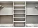 Spacious closet with built-in shelving and ample storage space for organization and convenience at 6957 Black Forest Dr, Elizabeth, CO 80107