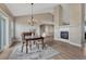 Inviting dining area featuring a stylish chandelier, hardwood floors, and seamless flow to the kitchen at 6957 Black Forest Dr, Elizabeth, CO 80107
