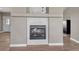Modern gas fireplace framed with contemporary tile work, set in a bright and airy living space at 6957 Black Forest Dr, Elizabeth, CO 80107