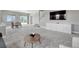 Open-concept living area featuring sleek design, natural light, and stylish furnishings at 6957 Black Forest Dr, Elizabeth, CO 80107