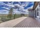 Enjoy outdoor living on this spacious deck with a metal safety rail and stunning nature views at 6957 Black Forest Dr, Elizabeth, CO 80107