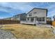 Home's backyard features a well-maintained lawn and a wooden fence at 9544 Pitkin St, Commerce City, CO 80022
