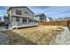 Home's backyard features a well-maintained lawn and a wooden fence at 9544 Pitkin St, Commerce City, CO 80022