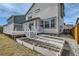 Backyard view featuring a back deck with stairs and garden beds at 9544 Pitkin St, Commerce City, CO 80022