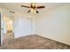 Bedroom featuring carpet and a ceiling fan with closet at 9544 Pitkin St, Commerce City, CO 80022