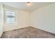 Bedroom with natural light highlighting plush carpeting and neutral walls at 9544 Pitkin St, Commerce City, CO 80022
