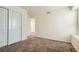Bedroom with plush carpet, neutral walls, and natural light from a large window at 9544 Pitkin St, Commerce City, CO 80022