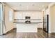 Bright kitchen features stainless steel appliances, granite counters, and a large center island at 9544 Pitkin St, Commerce City, CO 80022