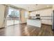 Modern kitchen with white cabinets, stainless steel appliances, and granite countertops at 9544 Pitkin St, Commerce City, CO 80022