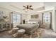 Spacious main bedroom suite with a tray ceiling and lots of natural light at 9544 Pitkin St, Commerce City, CO 80022