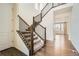 Elegant staircase with dark wood and black iron railings, leading to the second floor at 9544 Pitkin St, Commerce City, CO 80022