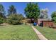 Expansive backyard with a storage shed and plenty of room for outdoor activities at 6043 S Cody Way, Littleton, CO 80123