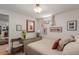 Bedroom with comfortable bed, soft lighting, and charming decor at 6043 S Cody Way, Littleton, CO 80123